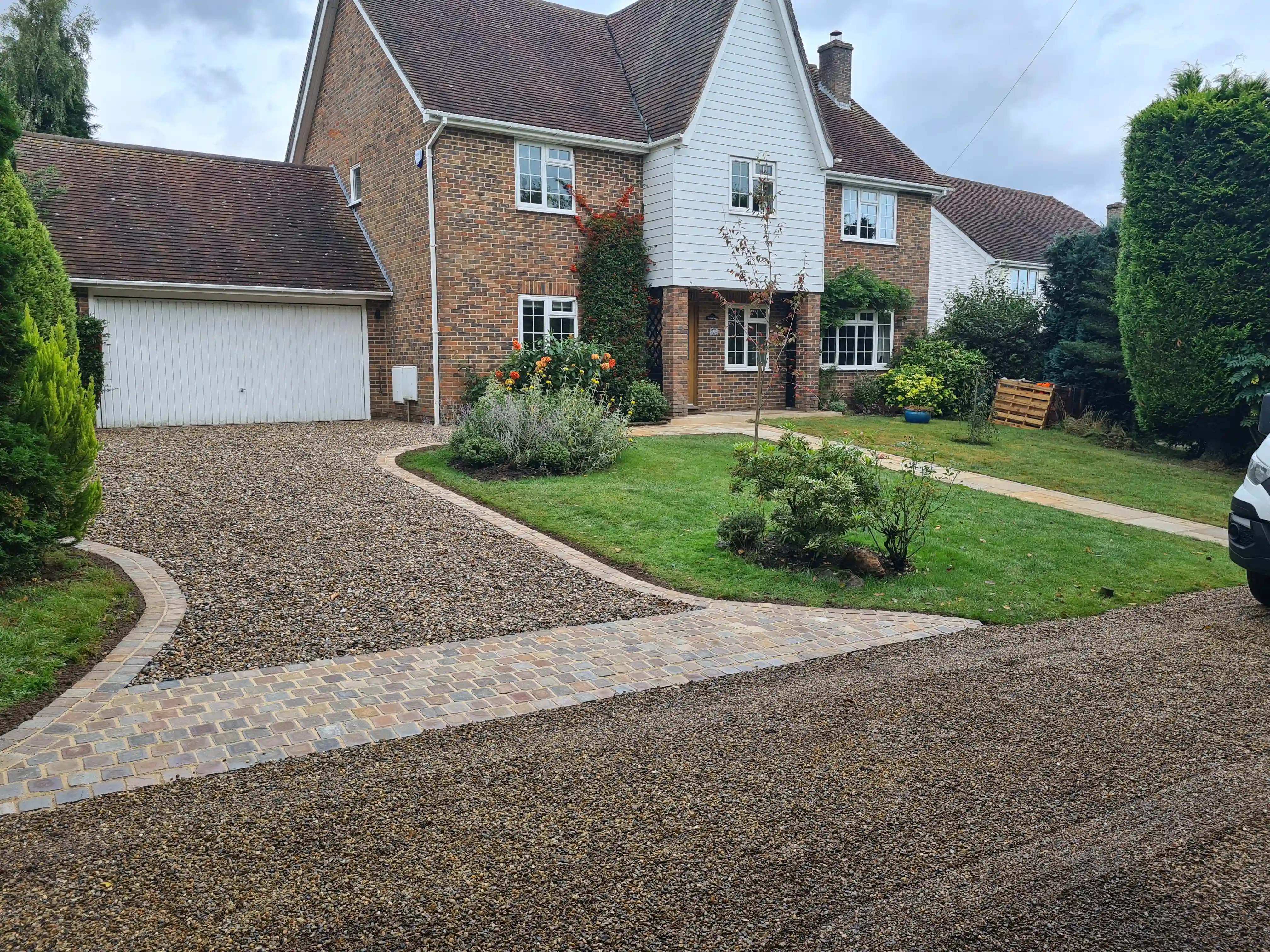 Freshly paved driveway and landscaping